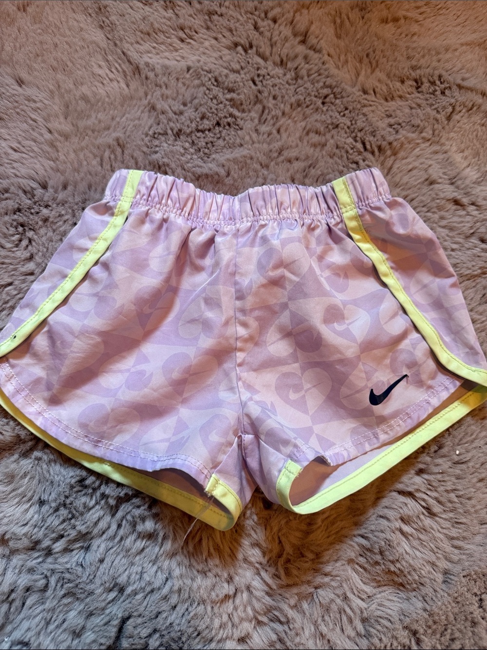Nike Girls' Light Pink Shorts with Yellow Trim and Navy Swoosh